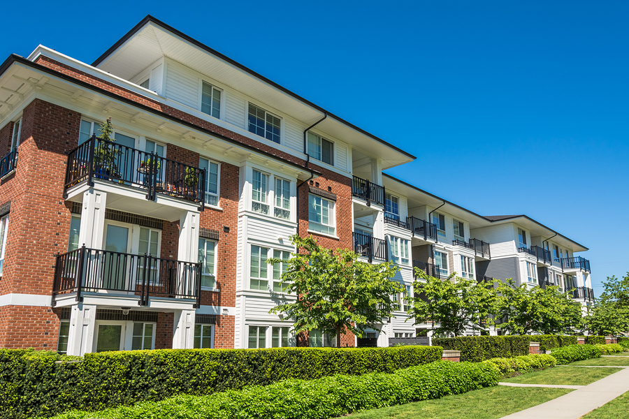 Brand new apartment building on sunny day in British Columbia Canada.